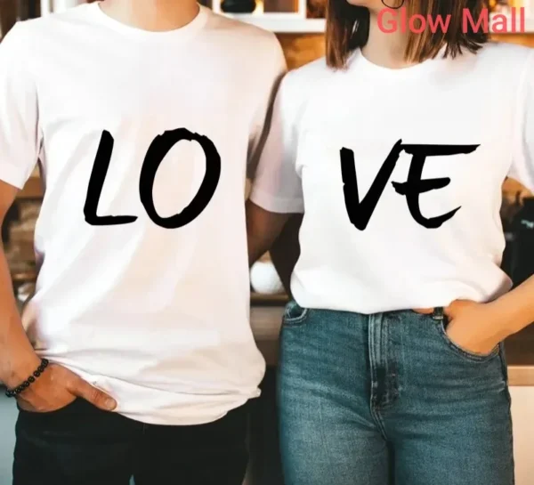 A couple wearing the classic white Glow Mall 'LOVE' matching t-shirt set, where the word 'LOVE' is split between their two shirts.