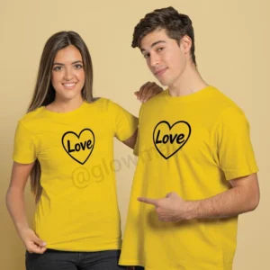 A young couple wearing matching yellow Glow Mall t-shirts with a black "Love" heart design, smiling for the camera.