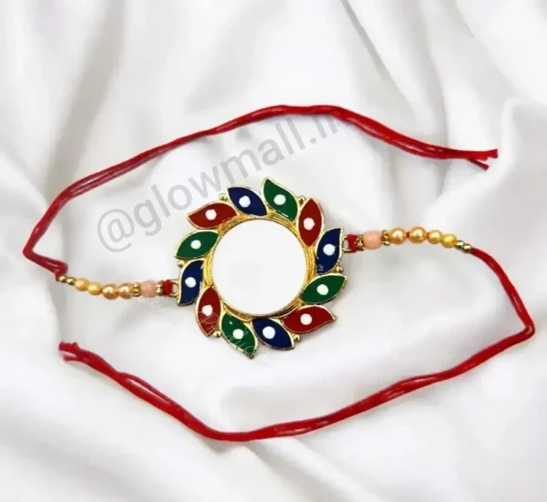 A blank personalized Rakhi from Glow Mall with a multi-colored petal design and a white center, ready for photo customization.