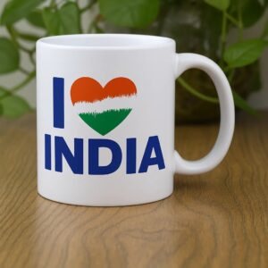 A white ceramic coffee mug with the text 'I ❤️ INDIA', where the heart is filled with the Indian tricolor flag.